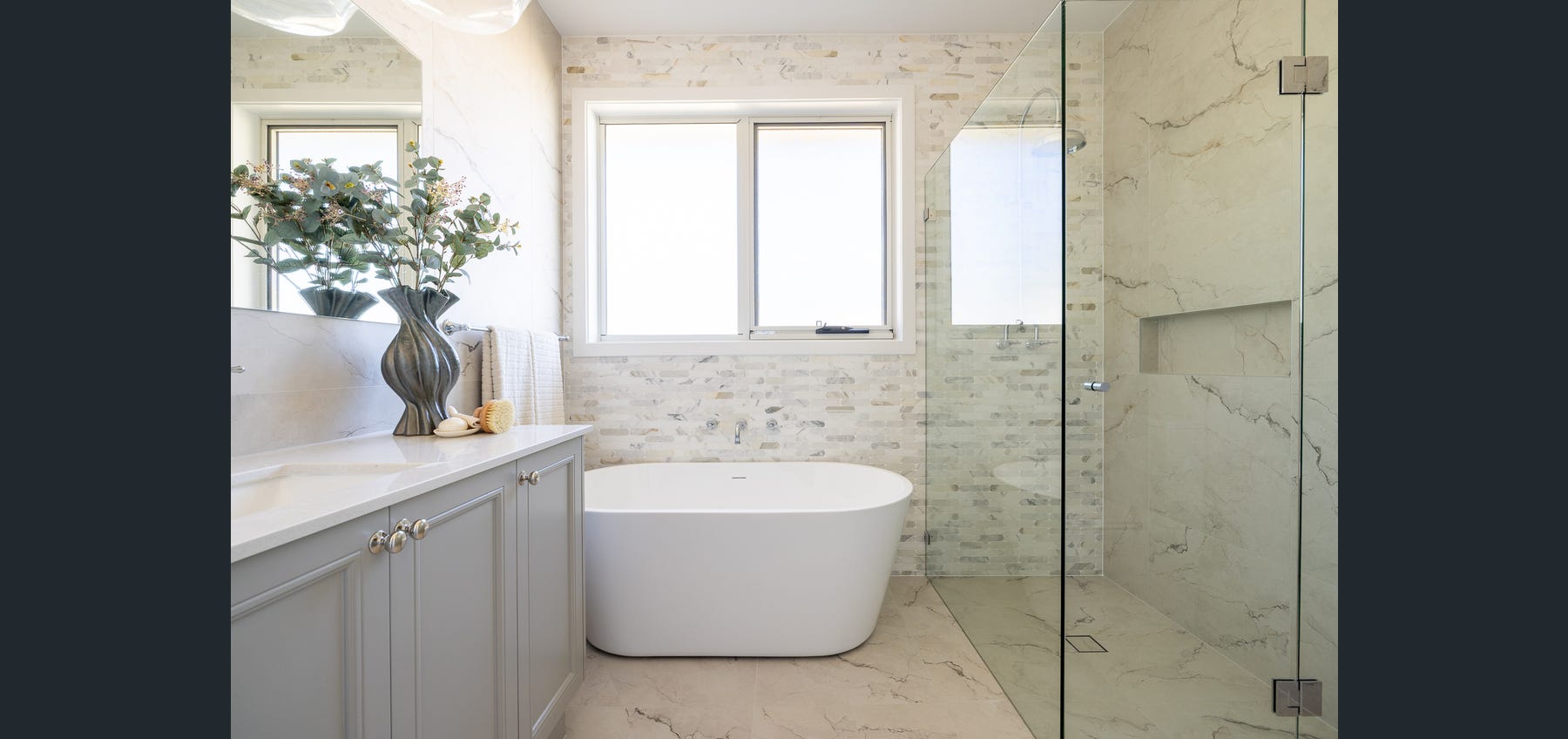 Completed ensuite with freestanding bath and walk-in shower